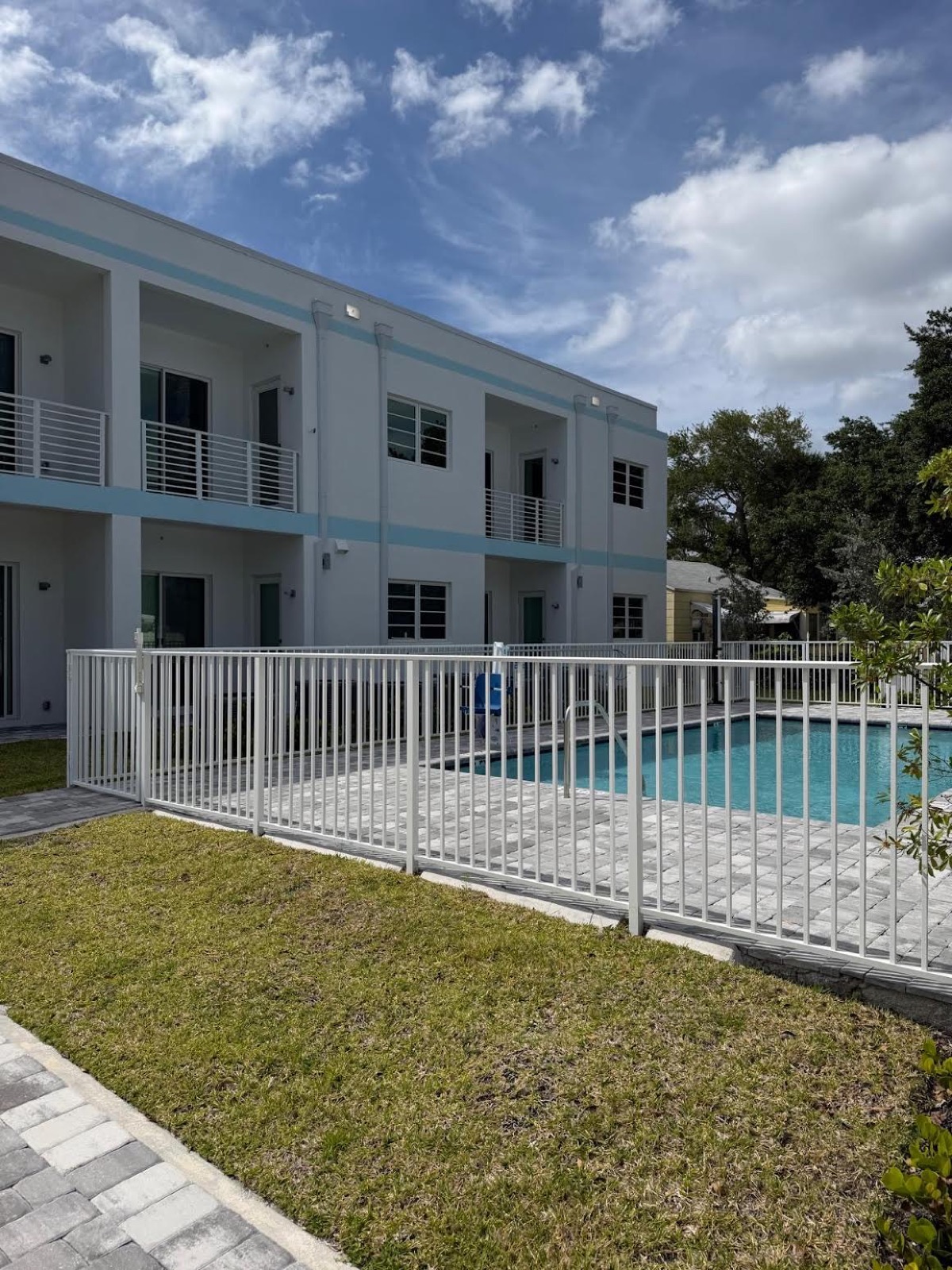 Ebb Tide residence exterior with pool and open sky — a calm environment for recovery