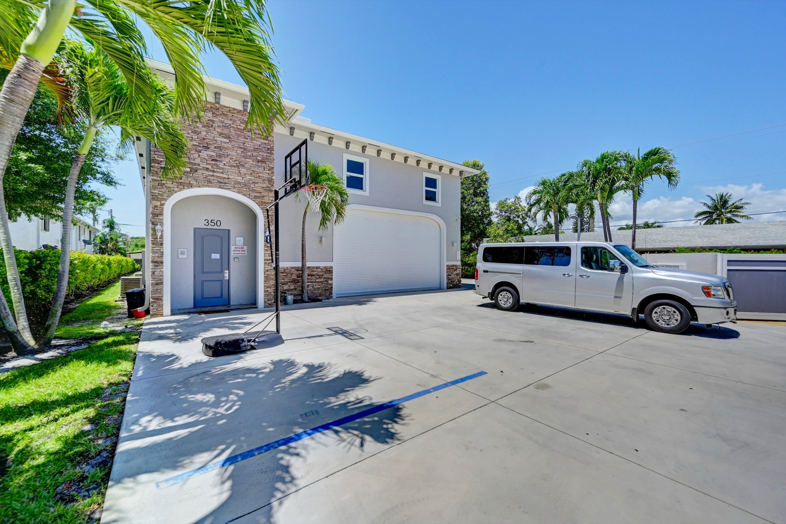 Street-level view of the Ebb Tide residence at 350 W Pine — the address visible on the front door