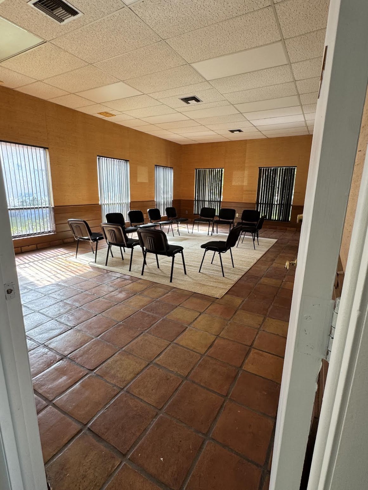 Group therapy room at Ebb Tide — chairs arranged in a circle, natural light from windows